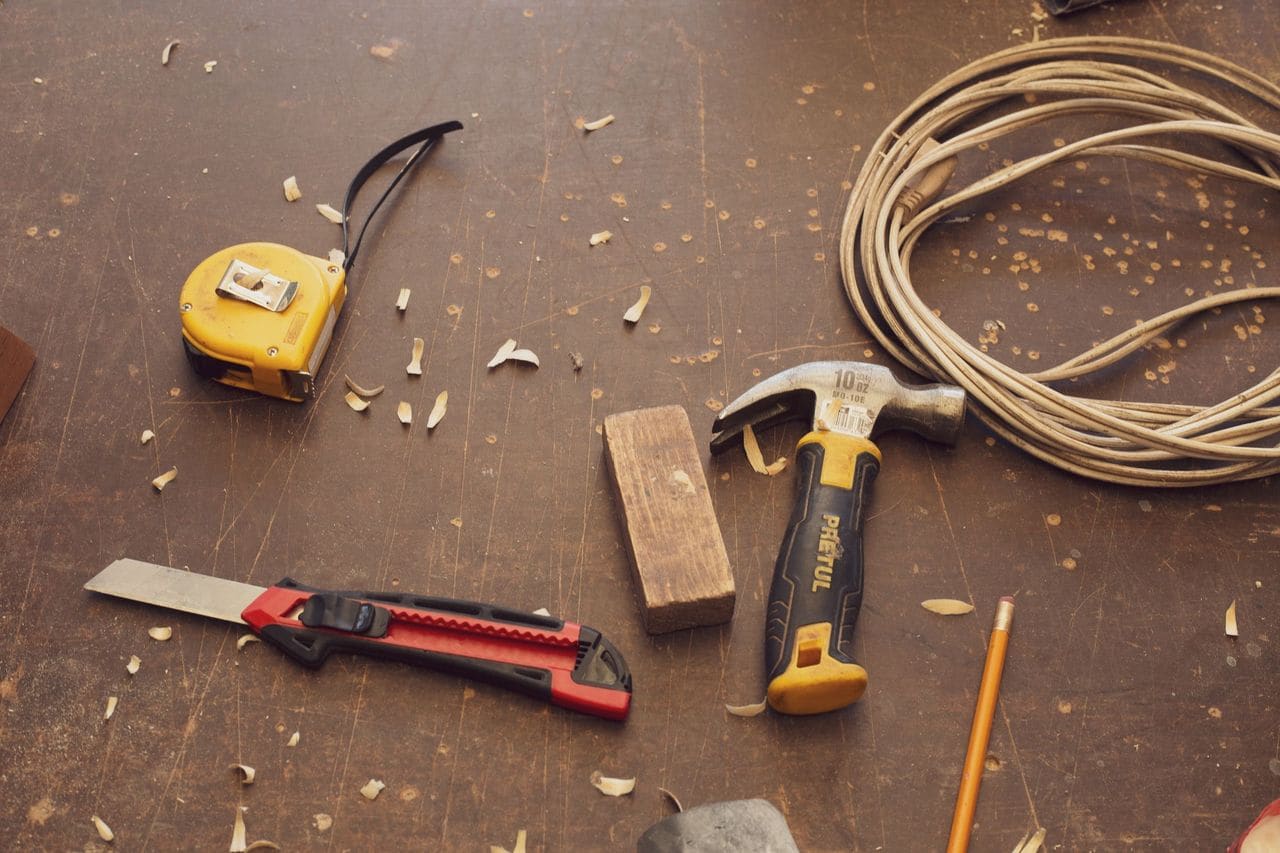 Carpentry tools on a workbench at a M&E Restoration job site